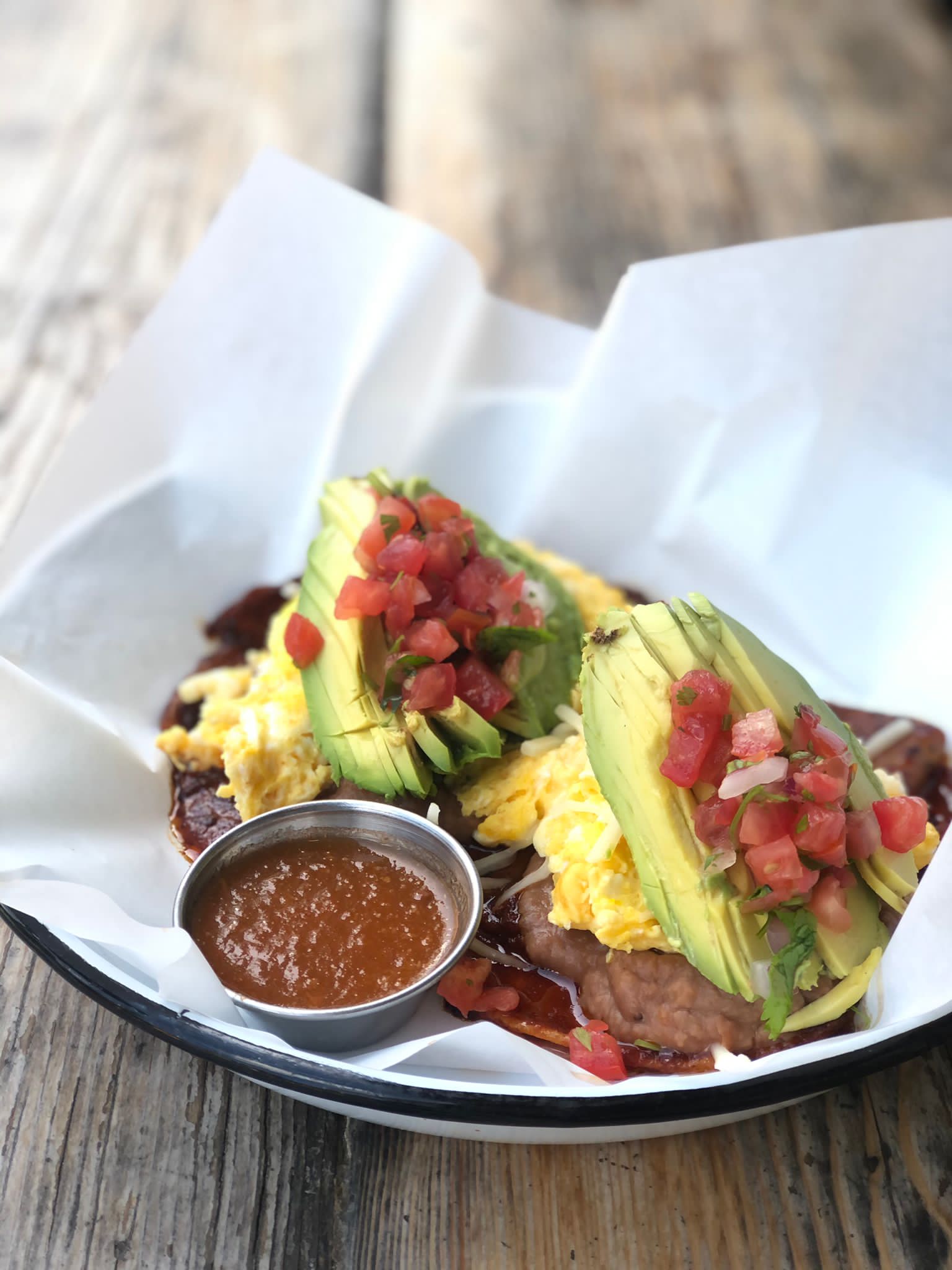 Ojai local Huevos Rancherso with Avocado and Guajillo Sauce